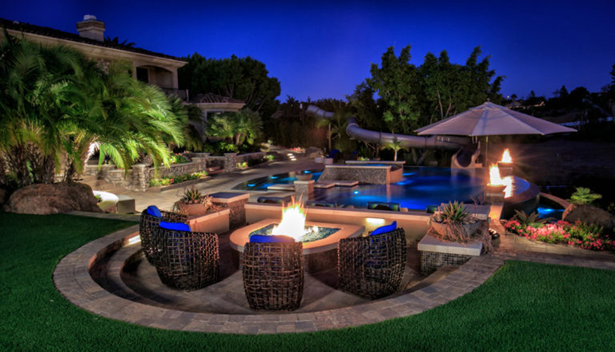 Incorporating Fire Features: Adding Warmth To Your Above Ground Pool Area